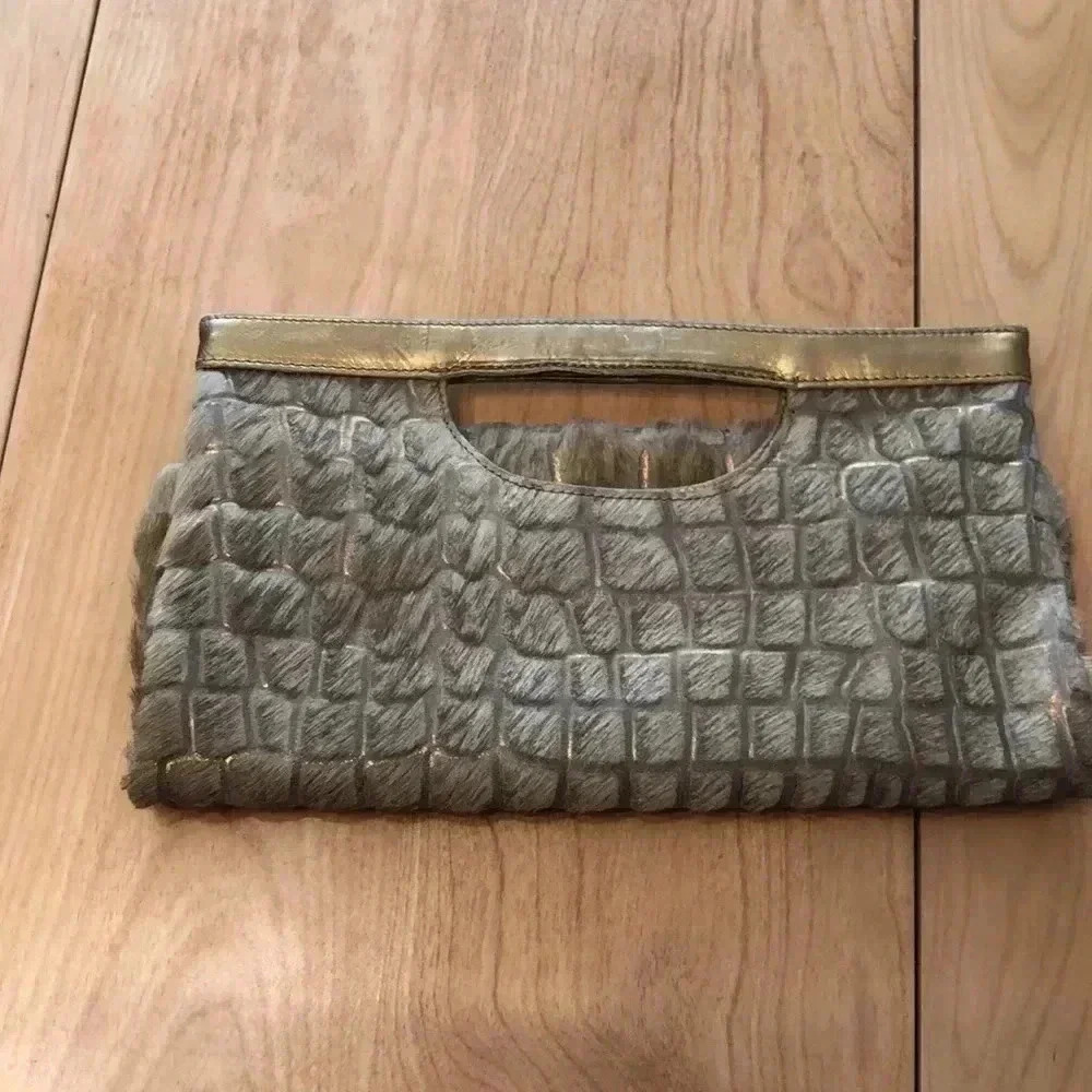Nordstrom leather handbag/clutch.  Animal print w/Gold leather + furry covering.